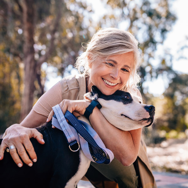 woman hugging her dog