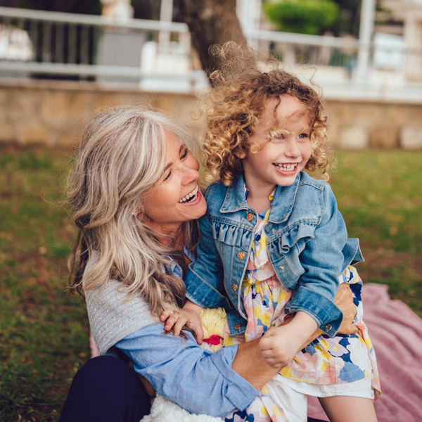 grandmother hugging granddaughter